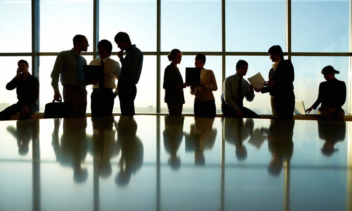 Silhouette of business people in boardroom