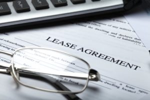 Eye Glasses on top of a Lease Agreement Contract